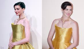 Anne Hathaway dazzles in a golden Oscar de la Renta gown at Bulgari’s Infinity Serpents Exhibition in Shanghai