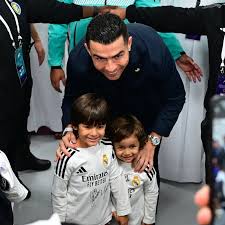 Cristiano Ronaldo signs football shirt for young fan at Globe Soccer Awards in Dubai despite security attempt to stop him