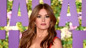 Isla Fisher stuns in a breathtaking red gown at the London premiere of Bridget Jones Mad About The Boy while embracing a fresh start after divorce