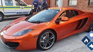 Law enforcement confiscates stolen McLaren during dramatic police operation on Kommetjie Road in Cape Town.