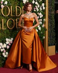 Zendaya stuns at the Golden Globes in Los Angeles as fans speculate about her engagement to Tom Holland after spotting a diamond ring.