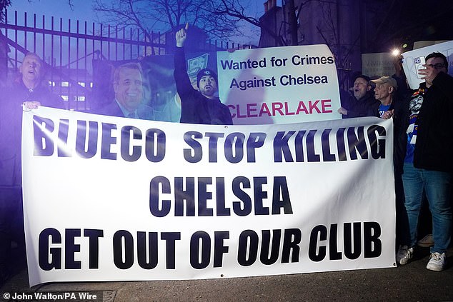 Angry Chelsea fans rally in front of Stamford Bridge calling out Todd Boehly and Clearlake Capital for mismanagement and lack of trophies since takeover