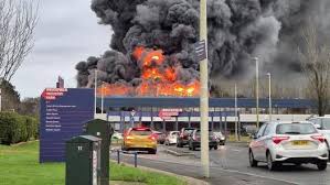 Massive Lorry Fire Erupts at Roundthorn Industrial Estate in Manchester Forcing Evacuations and Shutting Down Local Roads