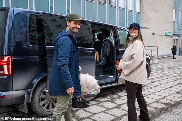 Swedish royal couple Princess Sofia and Prince Carl Philip radiate happiness as they depart Danderyds Hospital with their fourth child in their arms