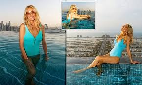 Tess Daly wows Instagram followers in stunning blue swimsuit during Dubai holiday while promoting her Naia Beach brand