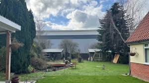 Villagers in Nacton Express Outrage as Giant 21m Warehouse Looms Over Their Homes and Replaces Scenic Views with a Metal Wall