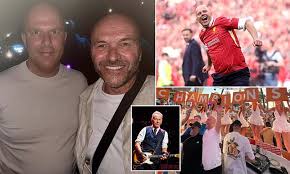 Arne Slot celebrates Liverpool’s Premier League title by dancing at a Bruce Springsteen concert in Manchester