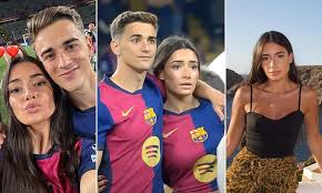 Barcelona star Gavi celebrates LaLiga title win with girlfriend Ana Pelayo as the couple display affection on the pitch at Olympic Stadium