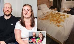 Husband Johnnie Norman Surprises Wife Rachel with Crisps Covered Bed as Birthday Gift at Blackpool Hotel and Ends Up Creating Hilarious Snack Disaster