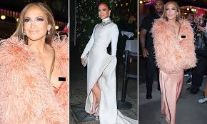 Jennifer Lopez suffers unexpected wardrobe slip while arriving in a plunging gown at Ring Them Bells concert in New York City