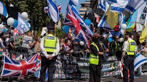 Jewish protester gets arrested in London after holding cartoon sign mocking Hezbollah leader during counter-demonstration