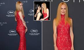 Nicole Kidman stuns in a red gown but suffers a visible wig mishap on the red carpet at Cannes Film Festival in France
