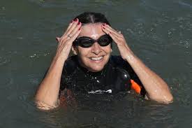 Paris Mayor Anne Hidalgo sparks national debate after photo of her swimming nude in Seine River during Olympic test event surfaces in France
