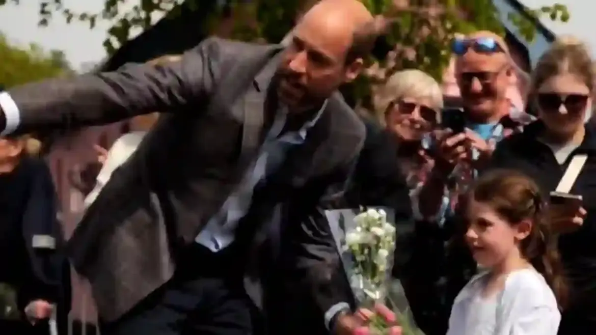 Prince William helps a shy little girl give flowers to Princess Kate during their romantic anniversary trip to the Isle of Mull