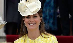Princess Kate returns to Buckingham Palace garden party in a sunshine-yellow dress and warmly