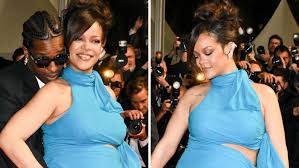 Rihanna dazzles fans as she walks the Cannes red carpet in a royal blue gown while showing off her baby bump alongside A$AP Rocky in France