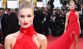 Rosie Huntington-Whiteley steals the spotlight in a bold red dress as she graces the Cannes Film Festival red carpet on day five of the star-studded celebration