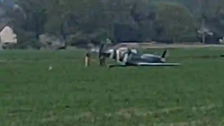 Historic Spitfire crash-lands in a farmer’s field while practicing a VE Day flypast in West Hythe Kent as emergency crews rush to the scene