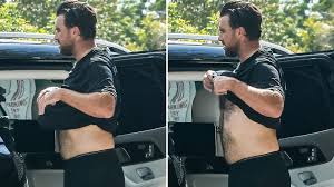 Travis Kelce shows off his famously hairy back during intense Miami workout as fans debate whether Taylor Swift minds the fur