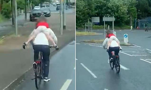 Disturbing Video Emerges of Man Recklessly Cycling with Child Clinging to Him Through Busy Roundabout in Belfast