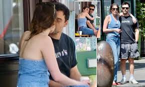 Aimee Lou Wood shares a romantic coffee date with co-star Adam Long as the two actors spark real-life romance rumours in London after filming new BBC series Film Club