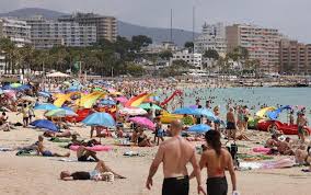 Angry residents in Mallorca demand officials take action as overcrowded beaches drive locals away from their own coastline