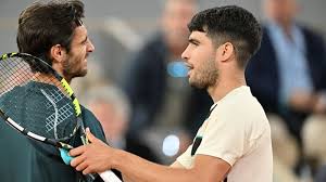 Carlos Alcaraz Battles Through Injury Retirement to Reach French Open Final in Paris