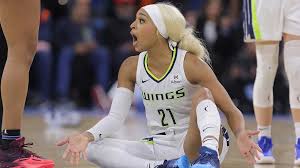 Dijonai Carrington accuses WNBA referee of racially charged overreaction after security is called during post-game exchange in Chicago