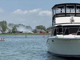 Helicopter crashes near Cabana Blue restaurant as stunned beachgoers watch in shock at Lake St Clair Michigan