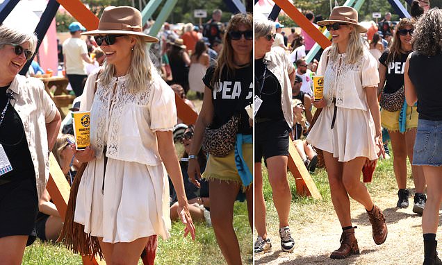 Holly Willoughby joins festival crowd and flaunts boho outfit while strolling through Glastonbury grounds in Somerset