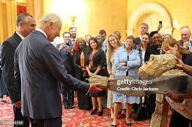King Charles greets life-sized gorilla puppet and climate activists during animated reception at Lancaster House in London