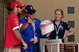 Michael Schumacher quietly signs charity helmet with wife Corinna’s help as hopes rise for his ongoing recovery in Switzerland