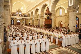 Over 450 children receive first Holy Communion as Christian families uphold faith traditions in Qaraqosh Iraq