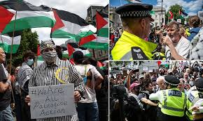 Pro-Palestine activist sparks outrage after wearing Holocaust-style uniform during protest at Trafalgar Square in London