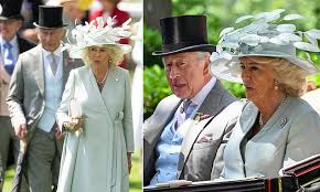 Queen Camilla battles strong winds and jokes with Lady Sarah during Royal Ascot carriage ride in Berkshire