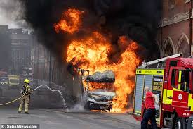 Van catches fire outside St Pancras station as emergency crews rush to extinguish flames and divert commuters in London
