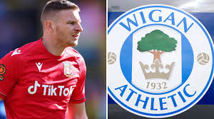 Wigan Athletic open loan talks with Wrexham striker Paul Mullin after tensions rise behind the scenes in North Wales