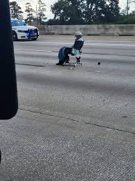Armed woman causes major traffic shutdown as she sits in the middle of Texas freeway after crashing into 18-wheeler and refusing to surrender