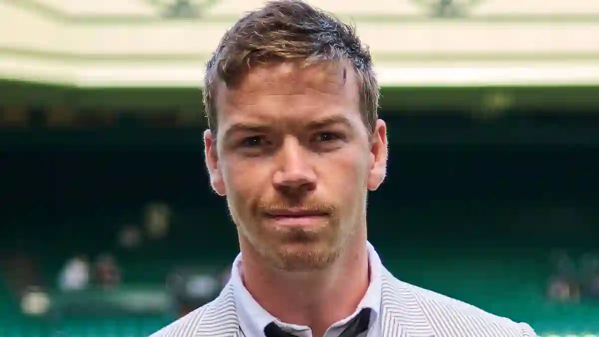 Will Poulter surprises fans with mismatched trousers while joining Benedict Cumberbatch and Rami Malek at Wimbledon’s star-filled semi-final day in London