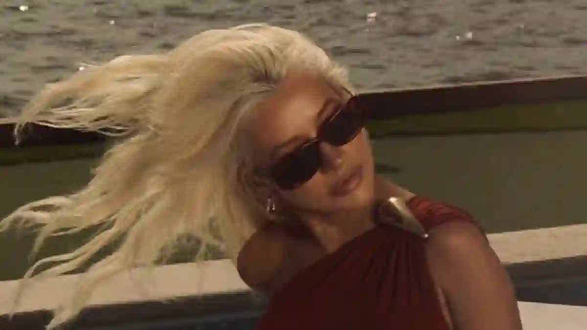 Christina Aguilera shares behind-the-scenes clips from poolside photoshoot in Miami highlighting her fashion-forward swimsuit and confident style