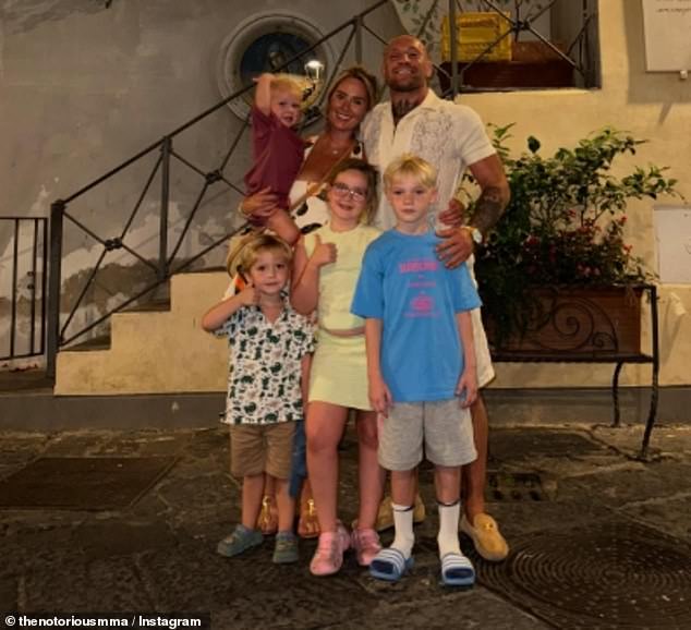 Conor McGregor shares a peaceful family photo with Dee Devlin and their children in Ireland while sparring footage in Italy and Spain sparks fan outrage