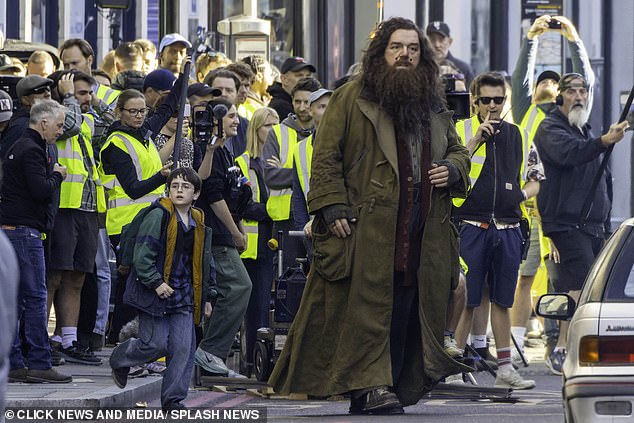Harry Potter fans spot Nick Frost in full Hagrid costume and Dominic McLaughlin as the boy wizard as filming outside a London pub halts traffic and draws huge crowds