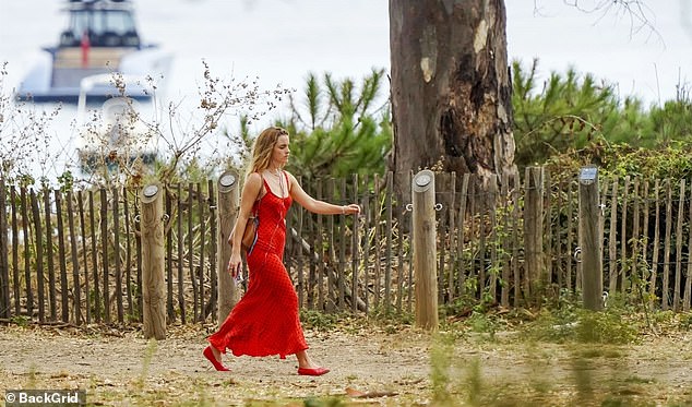 Emma Watson stuns fans in a red polka dot maxi dress as she enjoys a scenic coastal stroll in Saint-Tropez two months after sparking romance rumours in Oxford