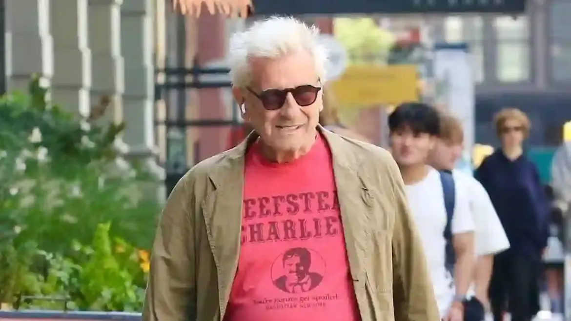 Griffin Dunne enjoys casual summer stroll through downtown Manhattan while walking his dog and bicycle in New York City