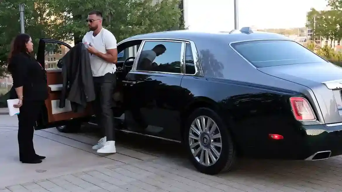 Travis Kelce arrives in a Rolls Royce at Chiefs red carpet premiere in Kansas City while Taylor Swift skips the event