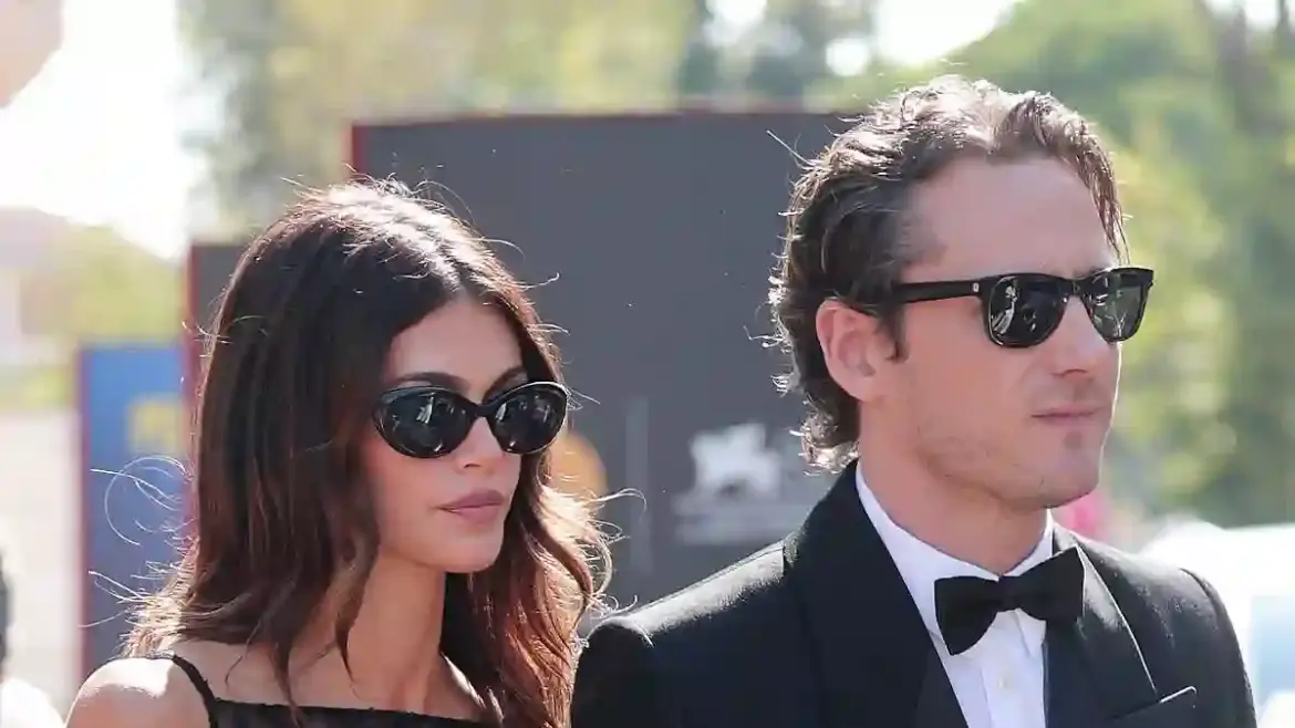 Kaia Gerber showcases romance with actor Lewis Pullman as the couple share kisses at the Venice Film Festival red carpet in Italy