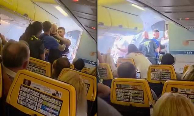Armed Spanish police drag two drunk British stag party passengers off Ryanair flight after mid air chaos from Leeds Bradford to Alicante