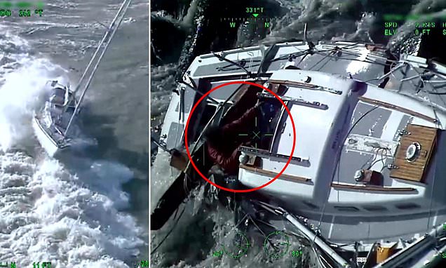 Coastguard helicopter rescue team battles raging waves to save stranded yacht skipper off the coast of Newhaven in East Sussex