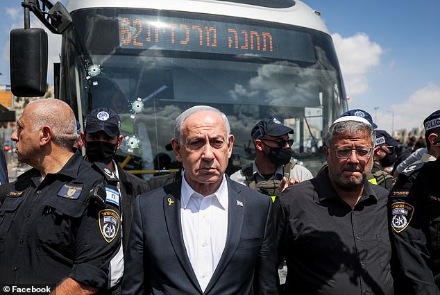 Gunmen open fire on a crowded bus stop killing six people including a pregnant woman in Jerusalem’s Ramot Junction