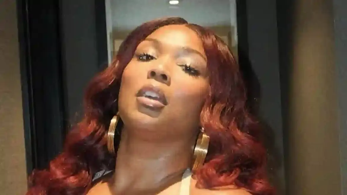 Lizzo Shows Off Incredible Physique in Crop Top and Miniskirt During Photoshoot at Hotel Hallway